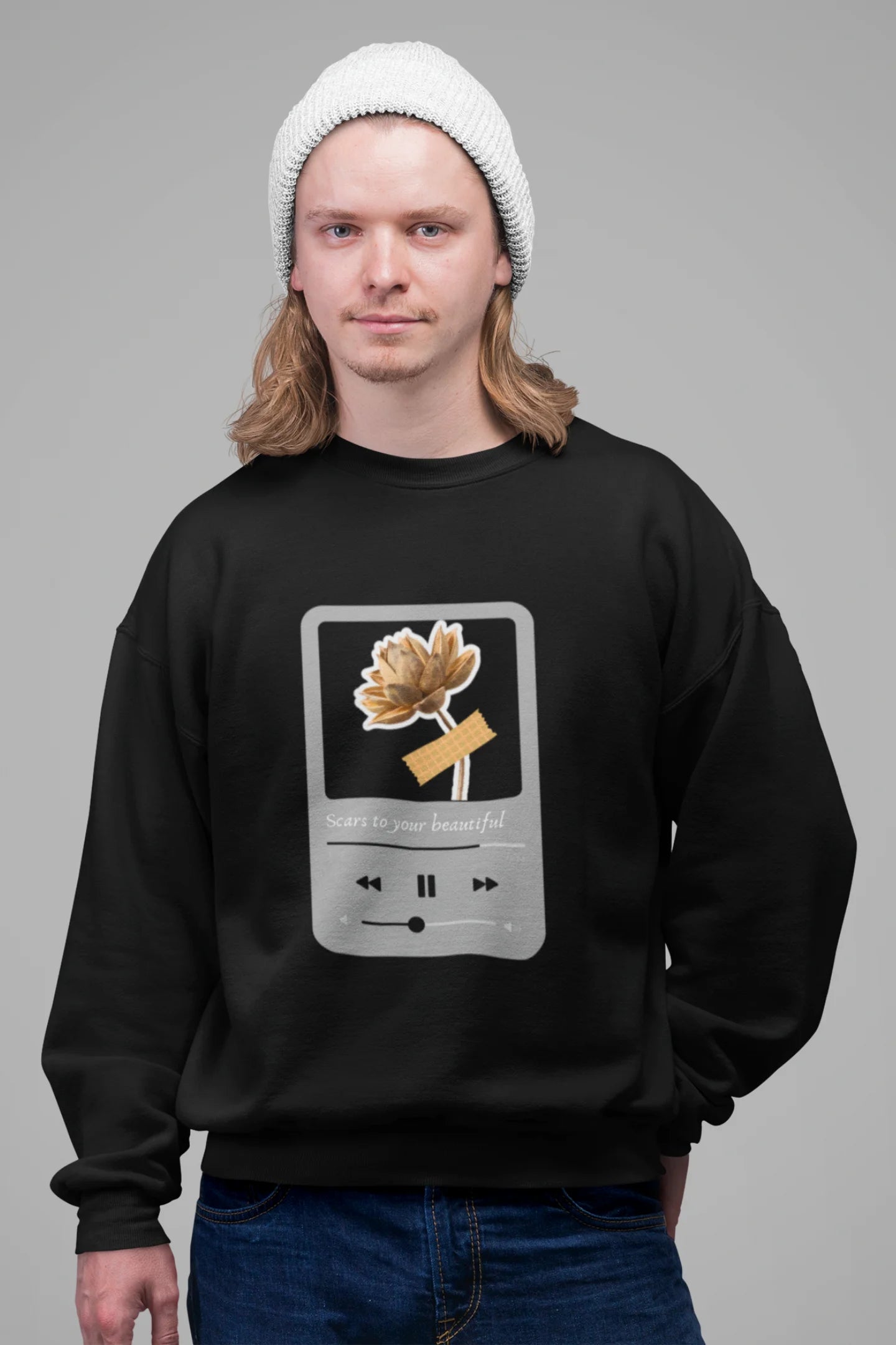 4th front view of a male model wearing a black sweatshirt featuring a design inspired by Alessia Cara's song "Scars to Your Beautiful." The design includes flowers and a message of self-love. Ideal for fans of Alessia Cara and those who appreciate messages of empowerment.