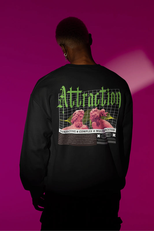 Second back view of a male model wearing a black sweatshirt with a brutalist design featuring two statues kissing and the word "Attraction".