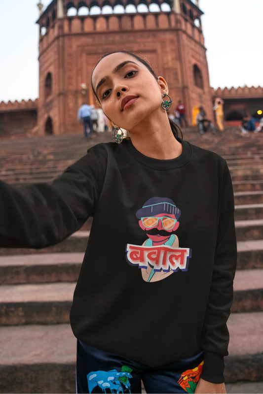 2nd front view of a female model wearing a black oversized t-shirt with "Bawaal" in a stylish Hindi.