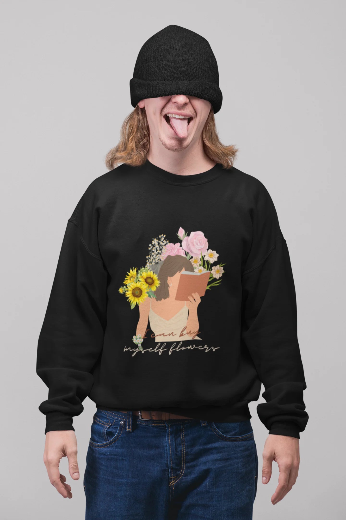 3rd front view of male model wearing a black sweatshirt with a positive message "Buy Myself Flowers" and a graphic of a smiling woman surrounded by tulips and sunflowers. Ideal for those who love inspirational clothing and floral designs.