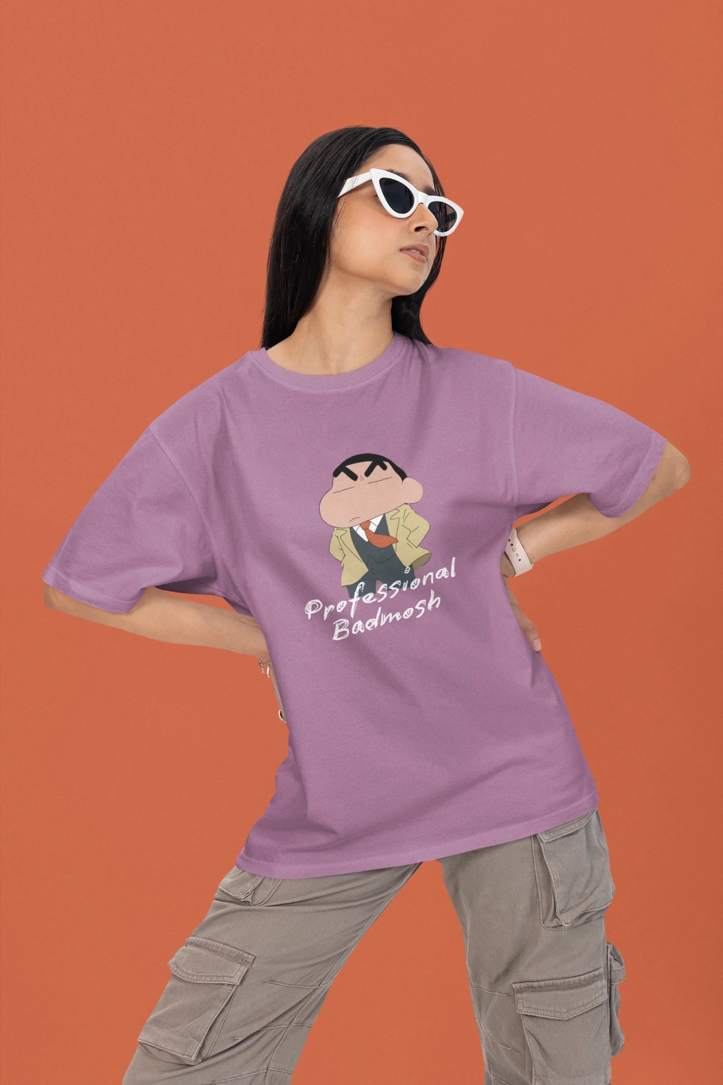 2nd front view of a female model wearing a dirty purple oversized t-shirt featuring Shinchan wearing a suit and trench coat with text saying "Professional Badmosh".