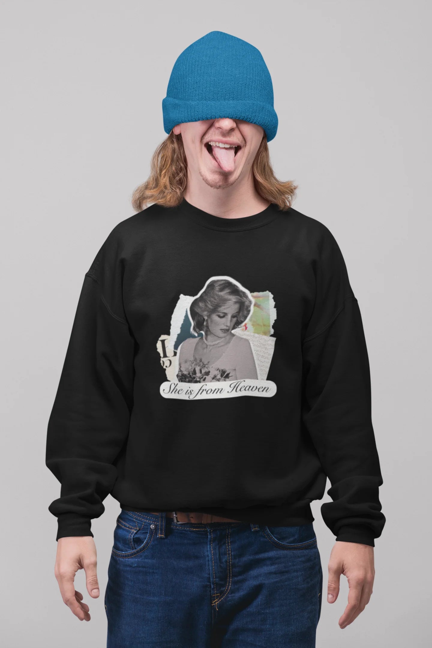 2nd front view of male model wearing a black sweatshirt featuring a black and white photo of Princess Diana with the text "She is from Heaven." Ideal for fans of Princess Diana and those who want to celebrate a royal icon.