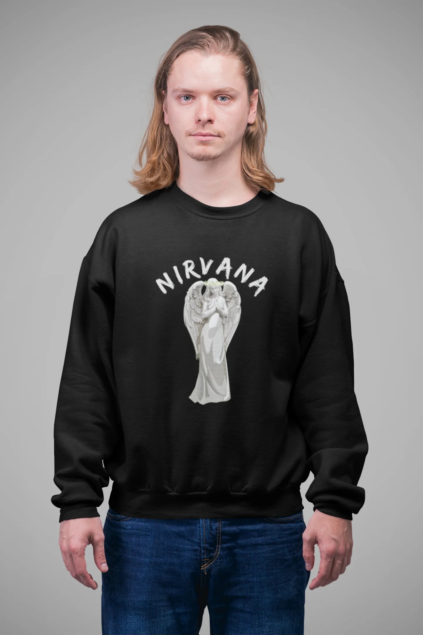 First front image of male model wearing a black sweatshirt featuring a design of a winged angel with the text "Nirvana" above it. Ideal for fans of Nirvana and those who love grunge aesthetics.