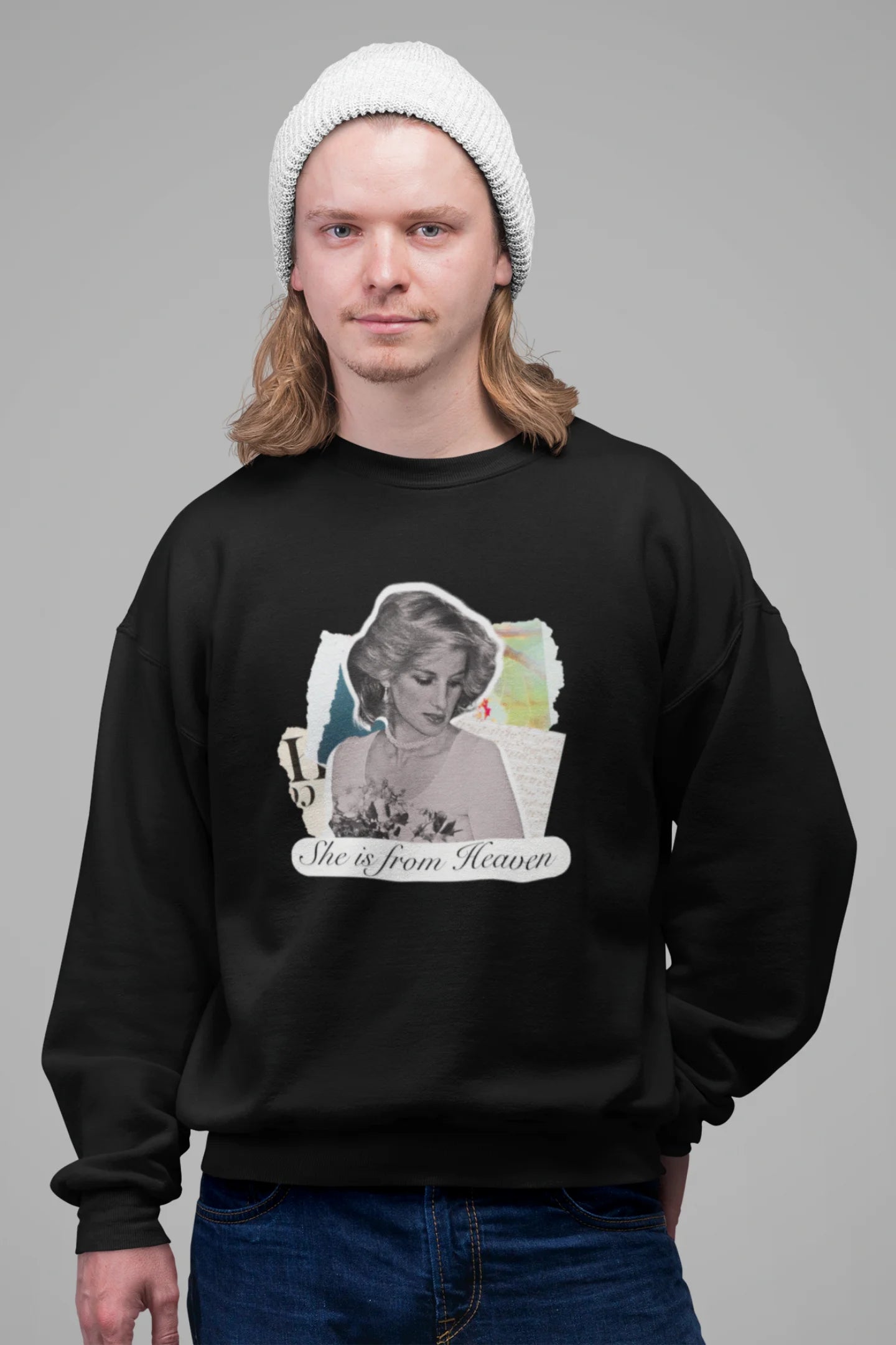 3rd front view of male model wearing a black sweatshirt featuring a black and white photo of Princess Diana with the text "She is from Heaven." Ideal for fans of Princess Diana and those who want to celebrate a royal icon.