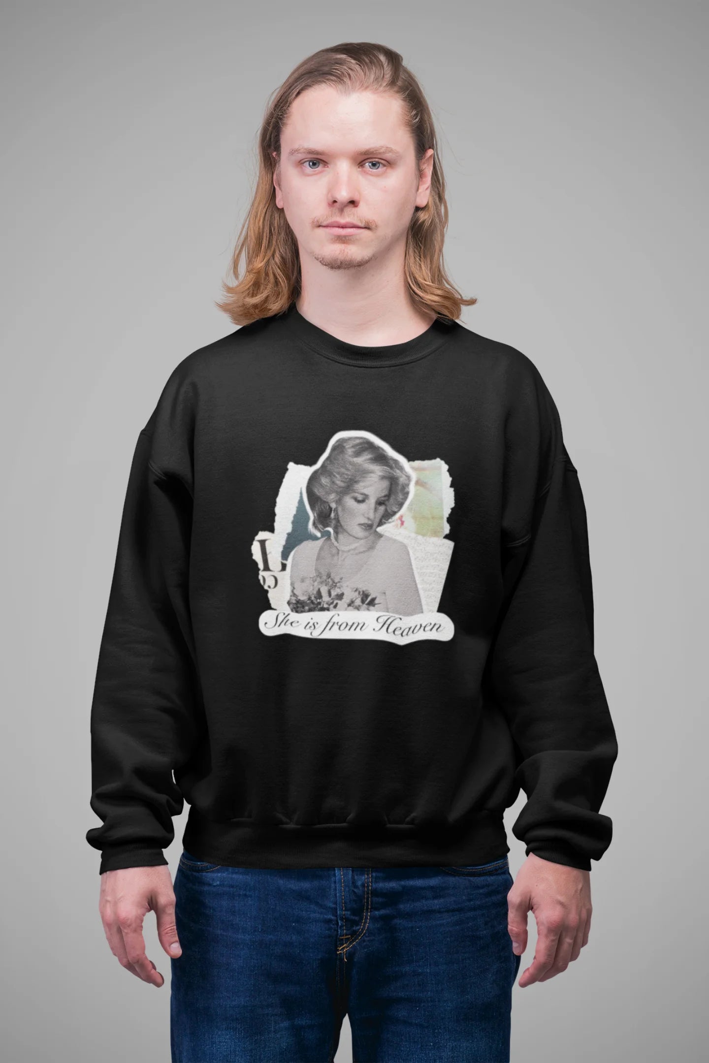 First front view of male model wearing a black sweatshirt featuring a black and white photo of Princess Diana with the text "She is from Heaven." Ideal for fans of Princess Diana and those who want to celebrate a royal icon.