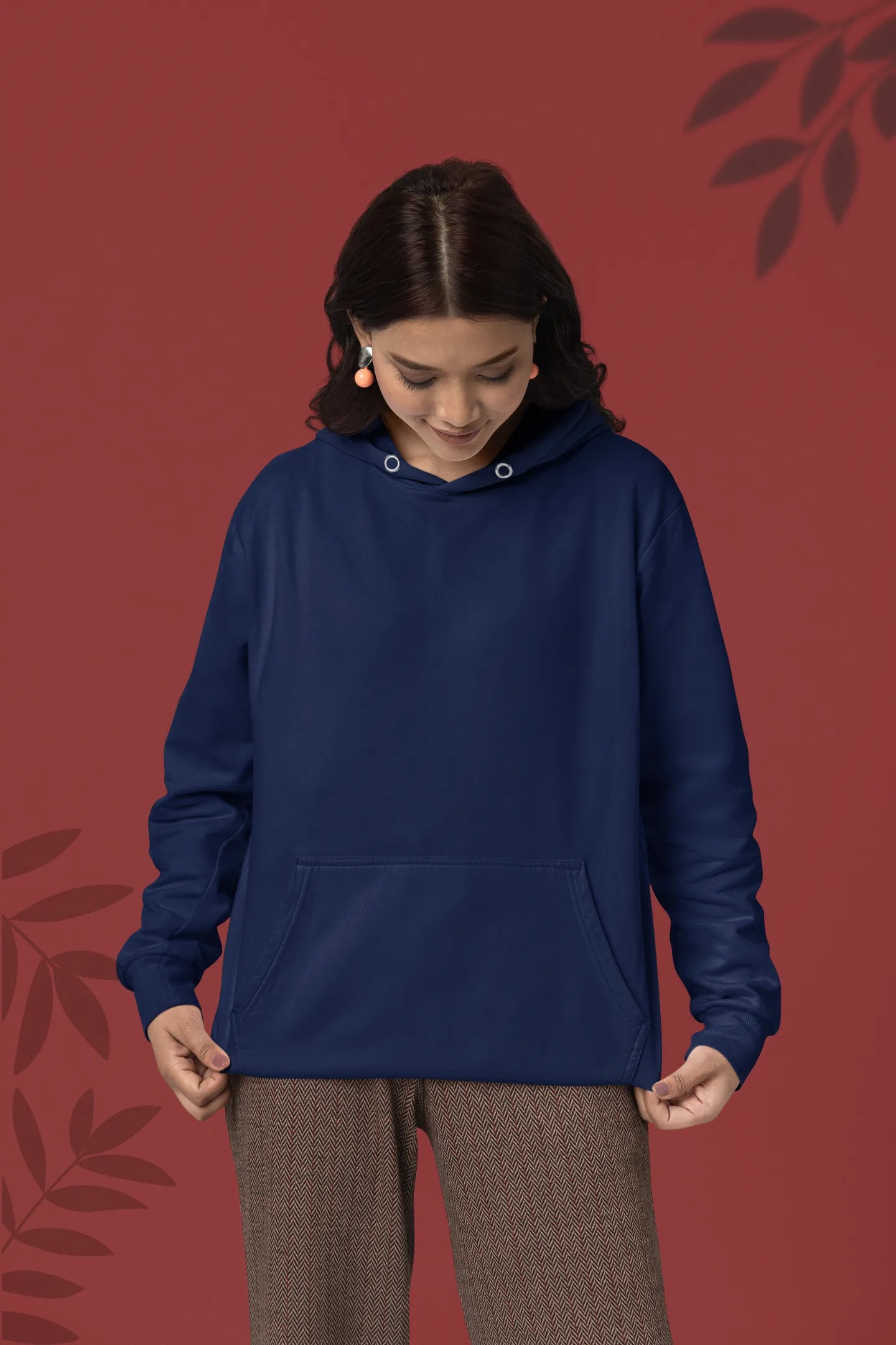First front view female model wearing a navy blue hoodie with a design of a fox and its cub in a traditional Japanese landscape.