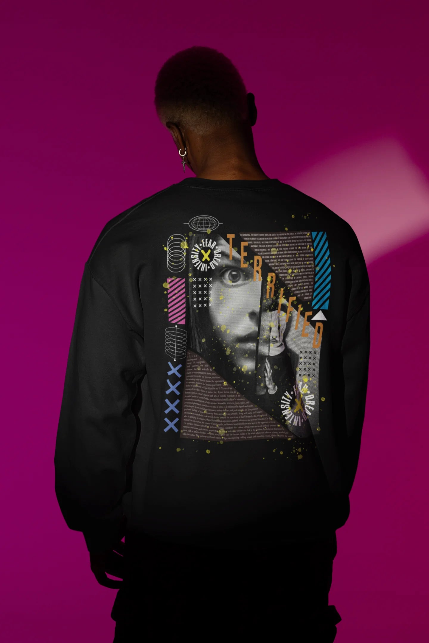 Second back view of a male model wearing a black brutalist-inspired sweatshirt featuring an abstract depiction of terrified people in a stylized font.