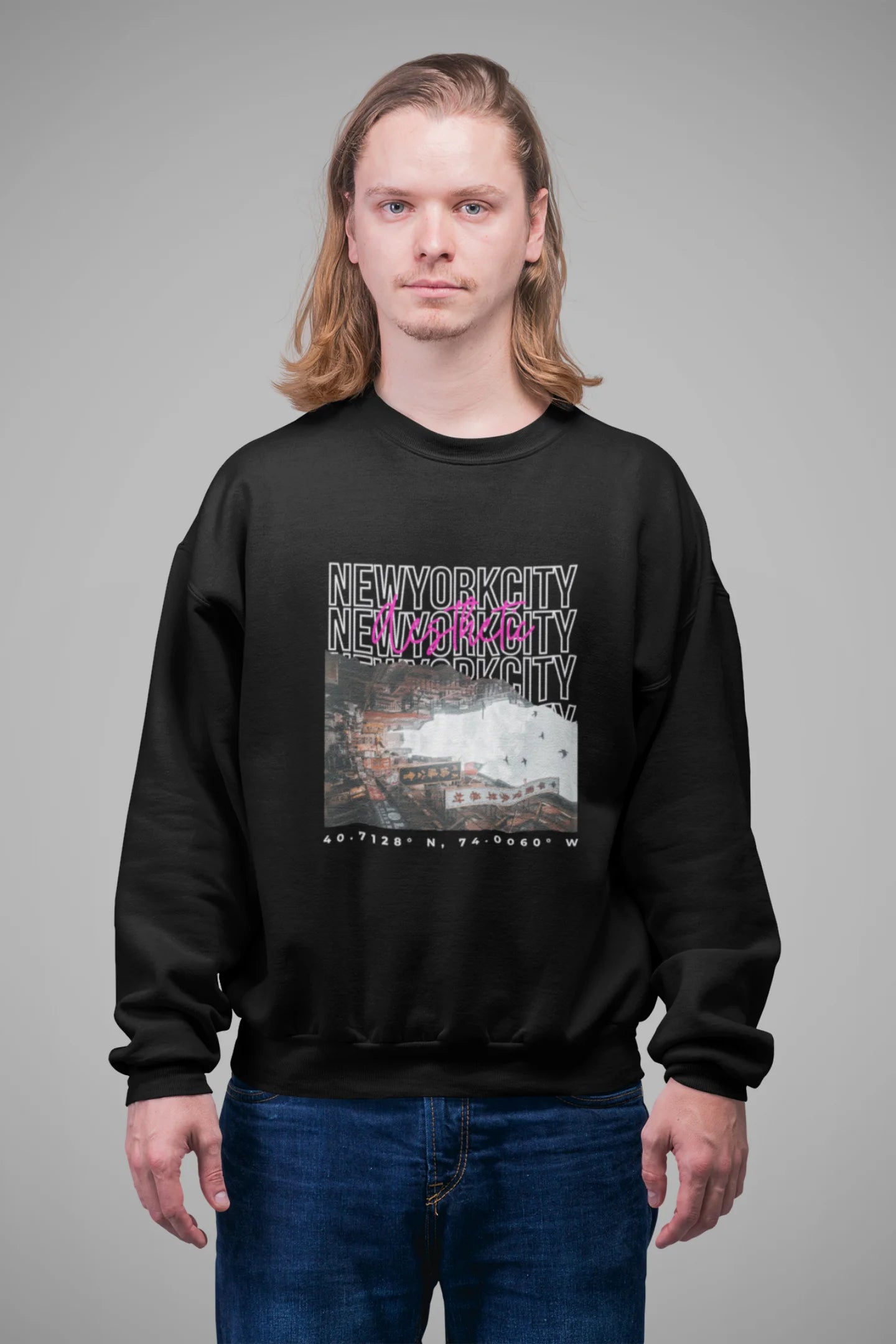 2nd front view of a male model wearing a black sweatshirt with a New York City skyline design, offering a relaxed urban aesthetic.