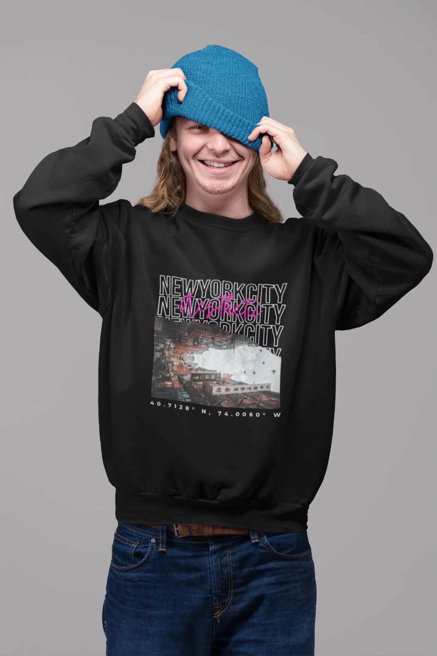 4th front view of a male model wearing a black sweatshirt with a New York City skyline design, offering a relaxed urban aesthetic.