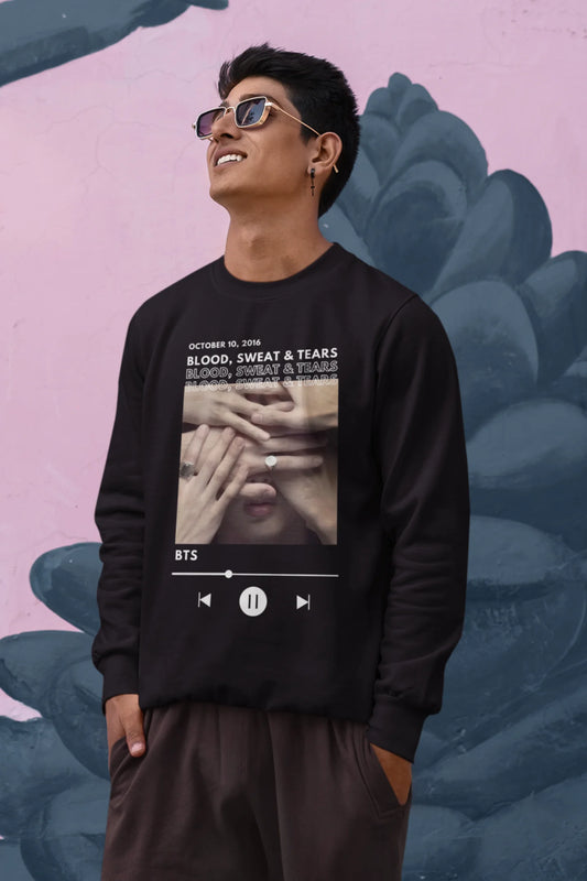 First front view of a male model wearing a black sweatshirt featuring a design inspired by BTS's music video "Blood, Sweat & Tears." Ideal for BTS fans (ARMY) who want to celebrate this iconic era.