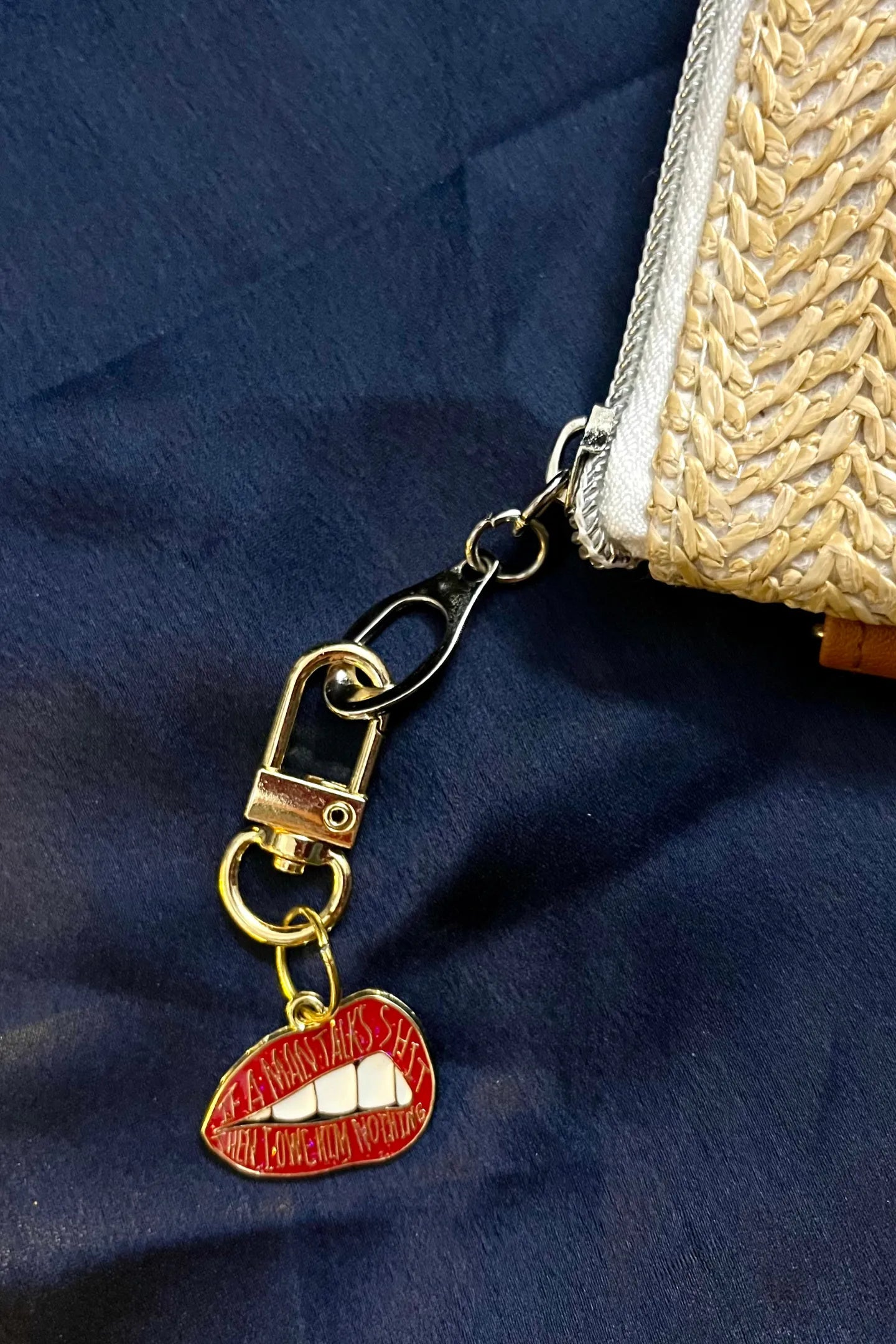 Fifth image of an keychain featuring the Taylor Swift phrase "You Owe Him Nothing" on a lip design. Perfect for all Swifties.