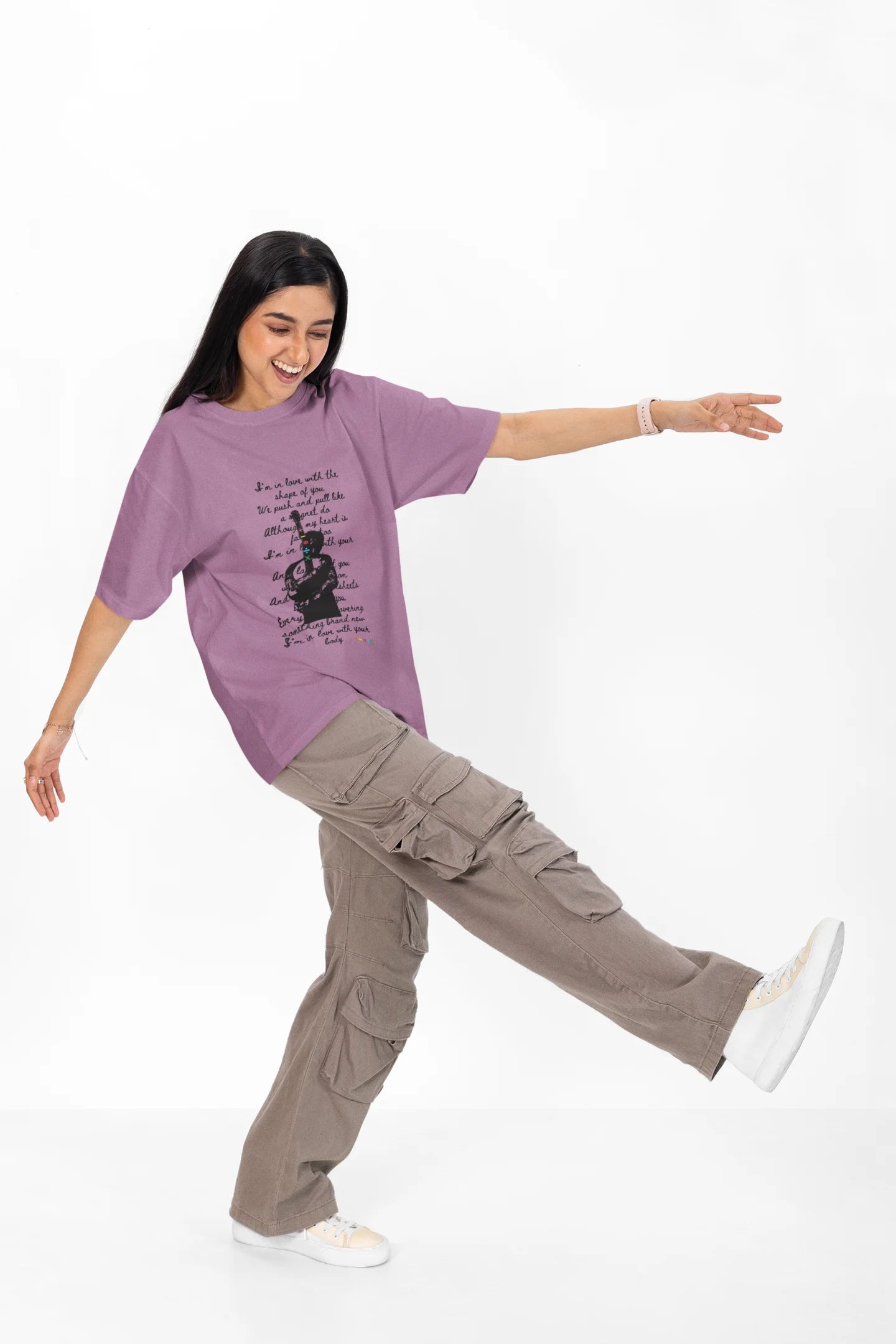 4th front view of a female model wearing a dirty purple oversized t-shirt featuring a design inspired by Ed Sheeran's concerts, related to the song "Shape of You."
