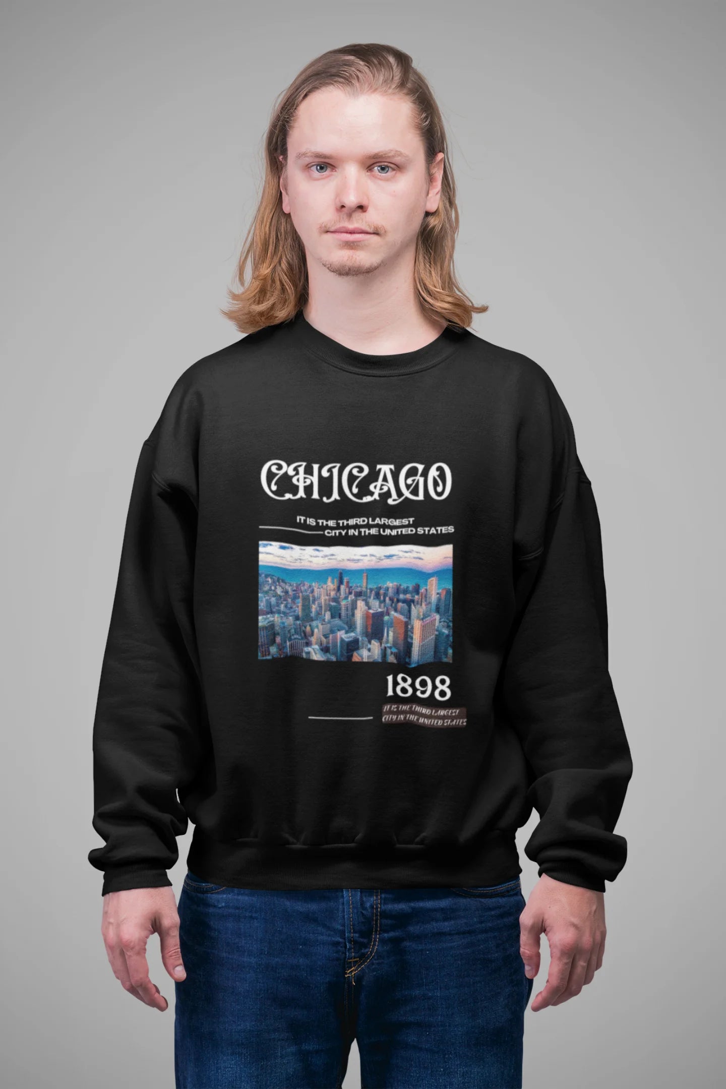 4th front view of male model wearing a black sweatshirt with a Chicago skyline design, offering a relaxed urban aesthetic.