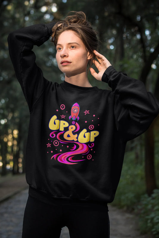 First front view of a female model wearing an black sweatshirt with a rocket ship design and the text "Up & Up".