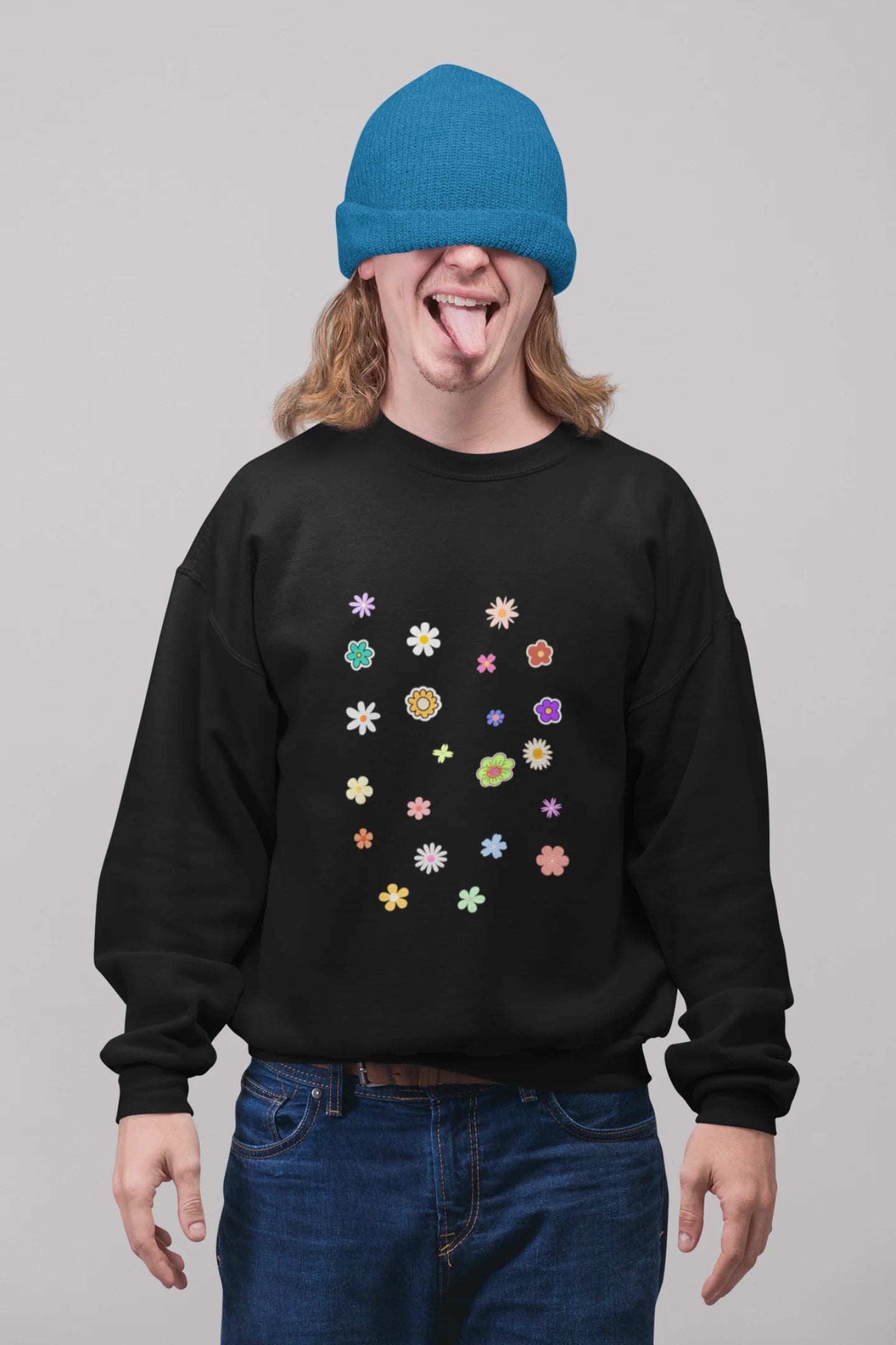 First front view of a male model wearing to a black sweatshirt featuring a vibrant floral design with roses, tulips, sunflowers, and orchids. Ideal for those who love floral patterns and spring fashion.