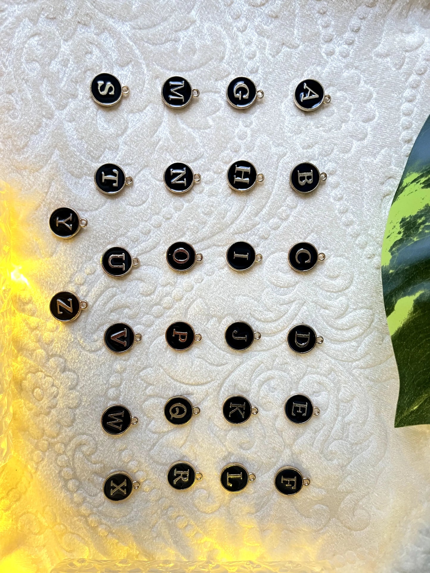 Third image of charms featuring personalized initials for couples.