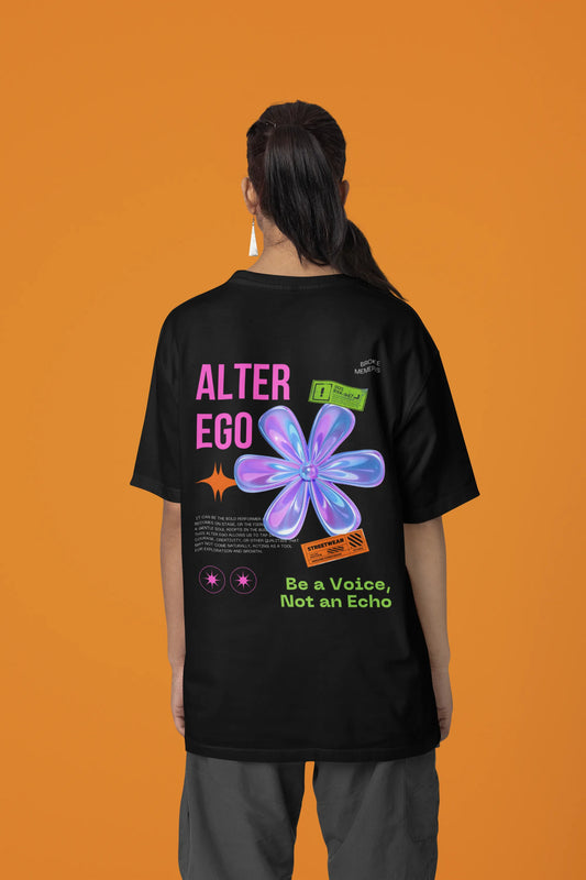 Back view of a female model wearing a black oversized t-shirt with a metal flower design and "Be a Voice, Not an Echo" slogan.