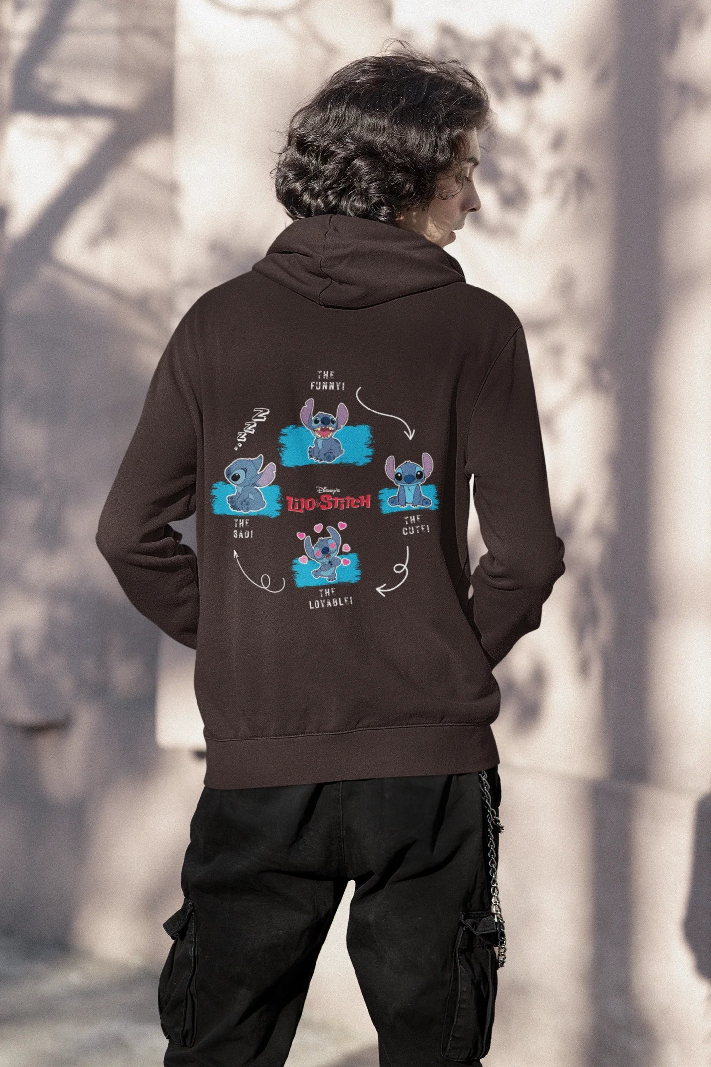 Back view of a male model wearing a chocolate brown hoodie with a collage of Stitch images. The illustration shows Stitch in different poses, making various funny faces and expressions.
