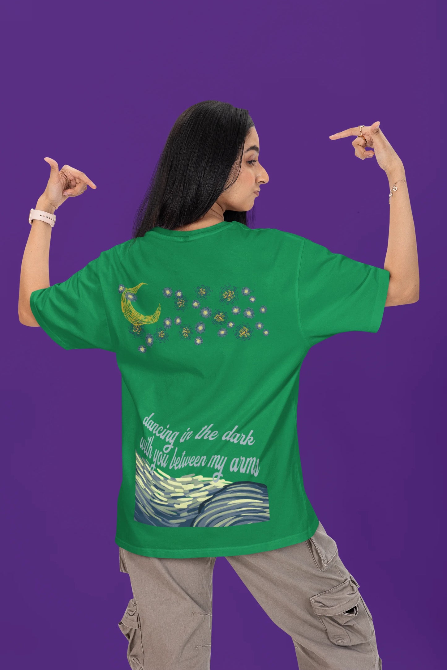 Back view of a female model wearing a forest green oversized t-shirt featuring lyrics from Ed Sheeran's song "Perfect" against a night sky design.