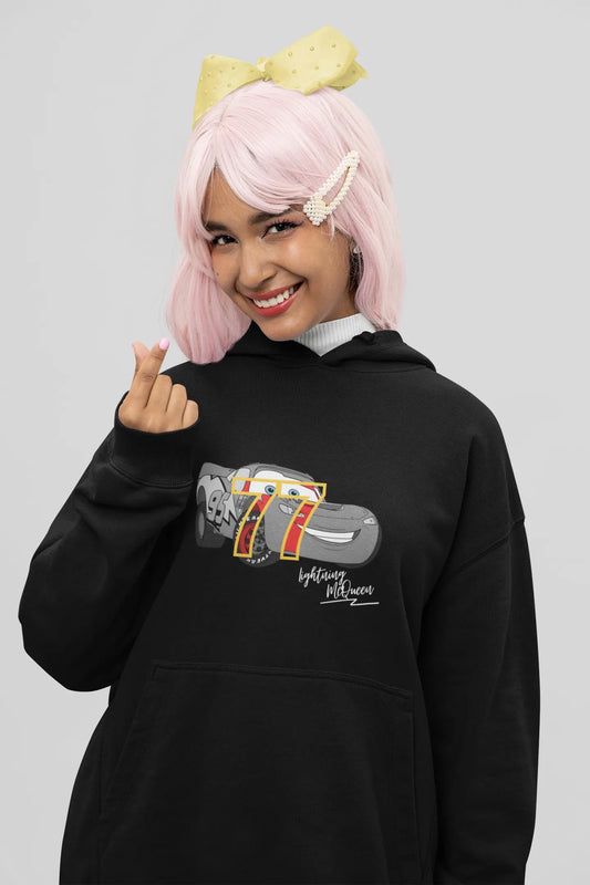 Close up front view of a female model wearing a black hoodie with a Disney Cars design featuring Lightning McQueen and the number 77.