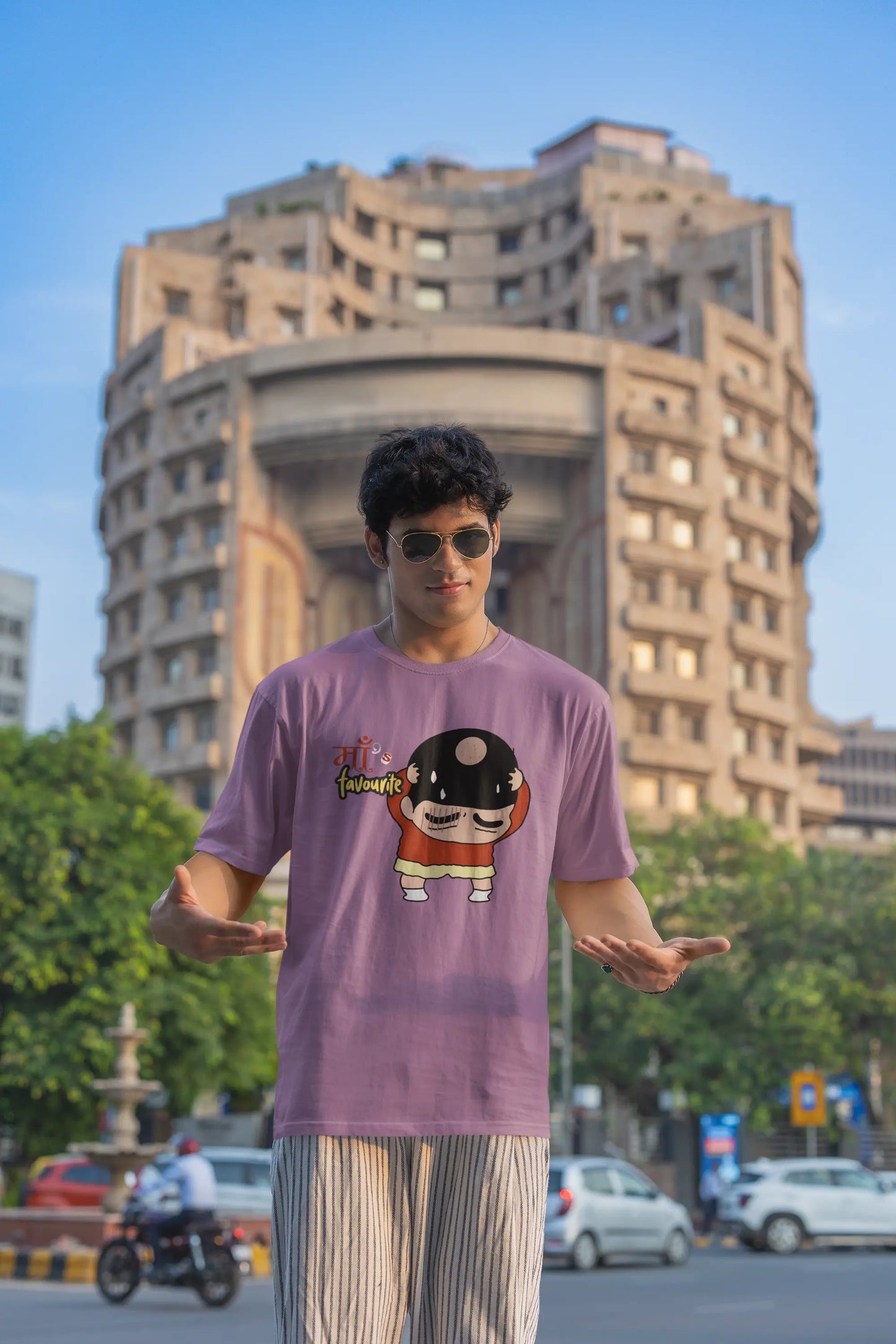 Third front view of male model wearing a dirty purple oversized tee featuring Shinchan with a classic bump on his head. A perfect blend of humor and nostalgia for Shinchan fans.