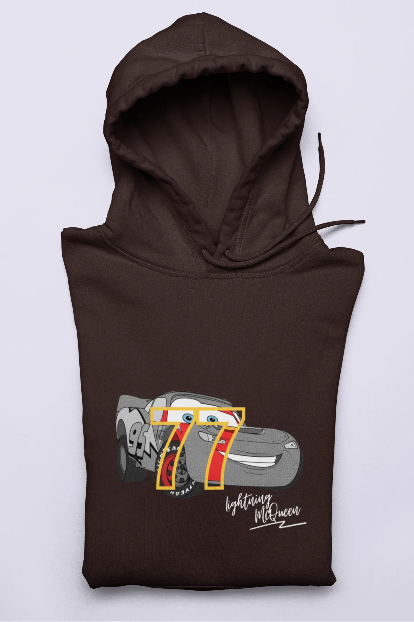 Close up front view of a chocolate brown hoodie with a Disney Cars design featuring Lightning McQueen and the number 77.