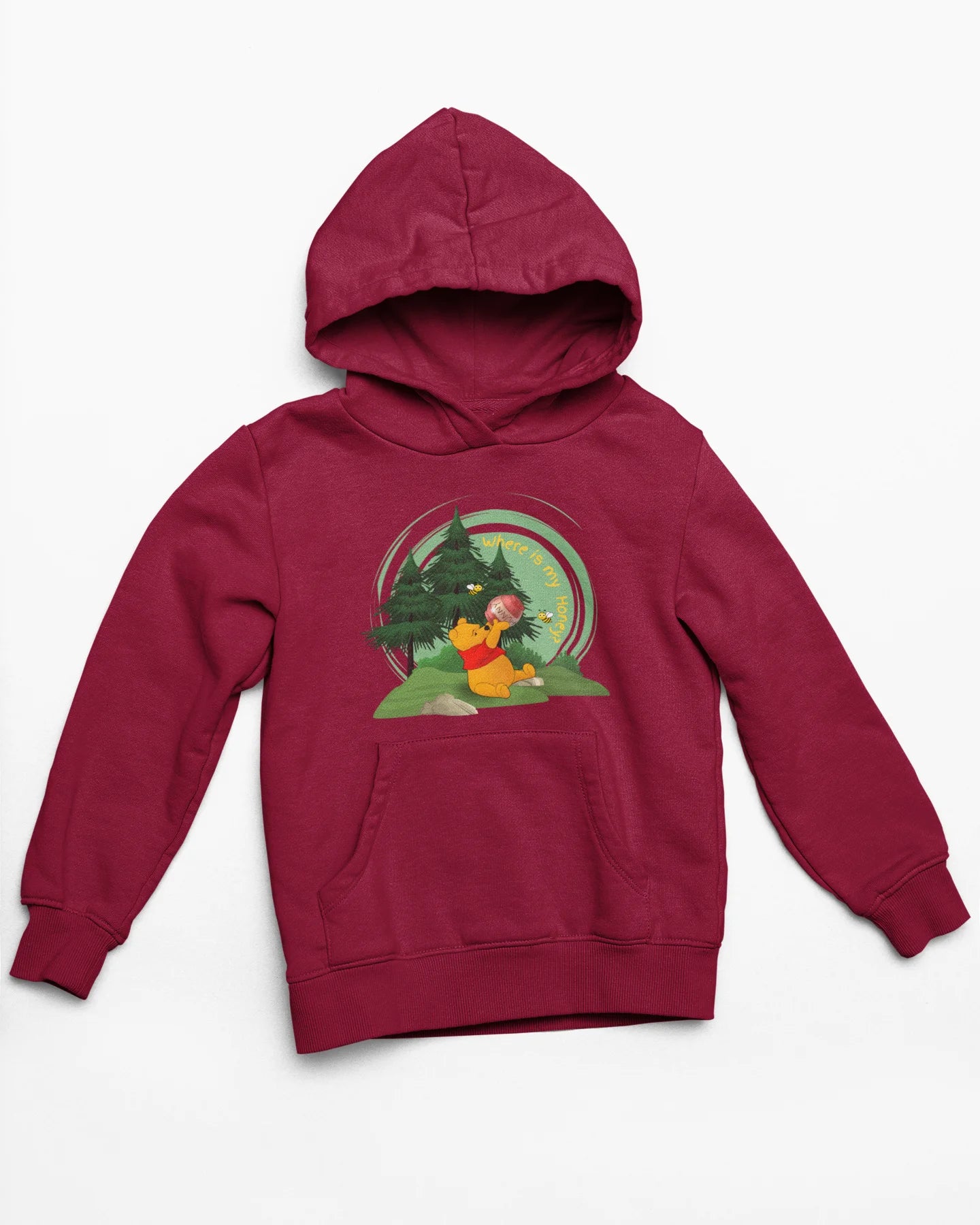 Close up front view of a maroon hoodie with a Winnie the Pooh design, showing the Disney bear eating honey from a jar in a forest.
