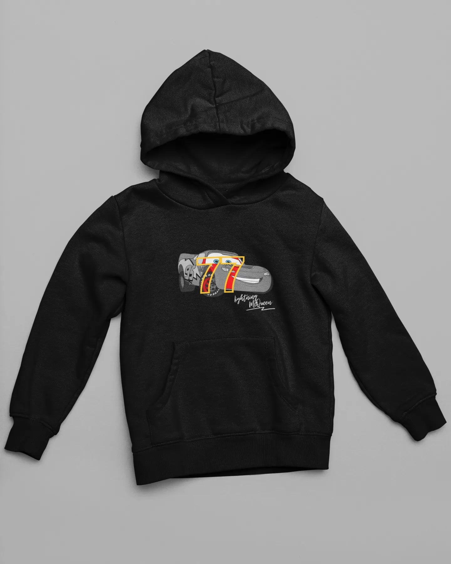 Front view of a black hoodie with a Disney Cars design featuring Lightning McQueen and the number 77.