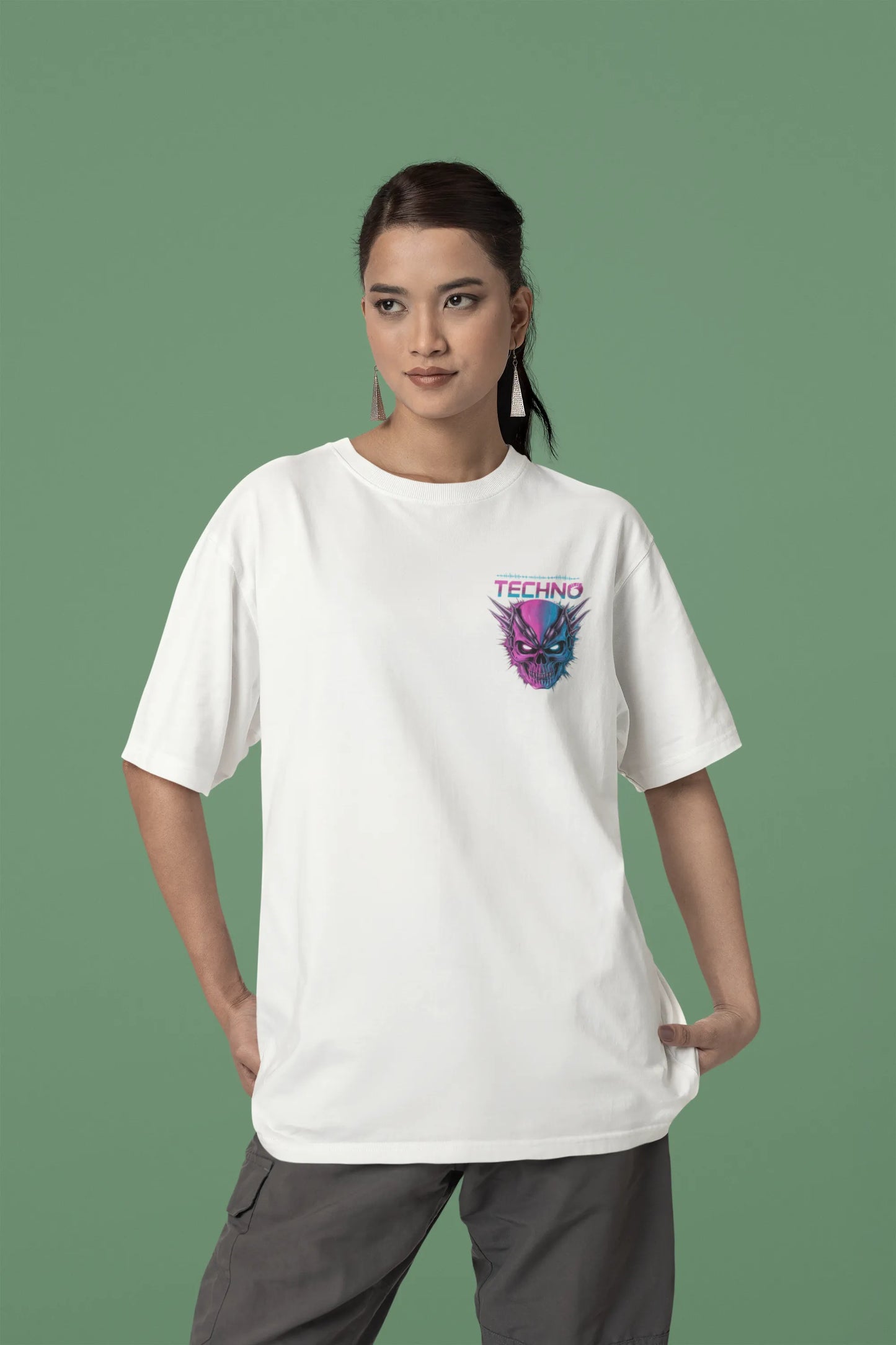 Second front view of a female model wearing an off-white oversized t-shirt with a stylized Techno Skull design, perfect for rave and party vibes.