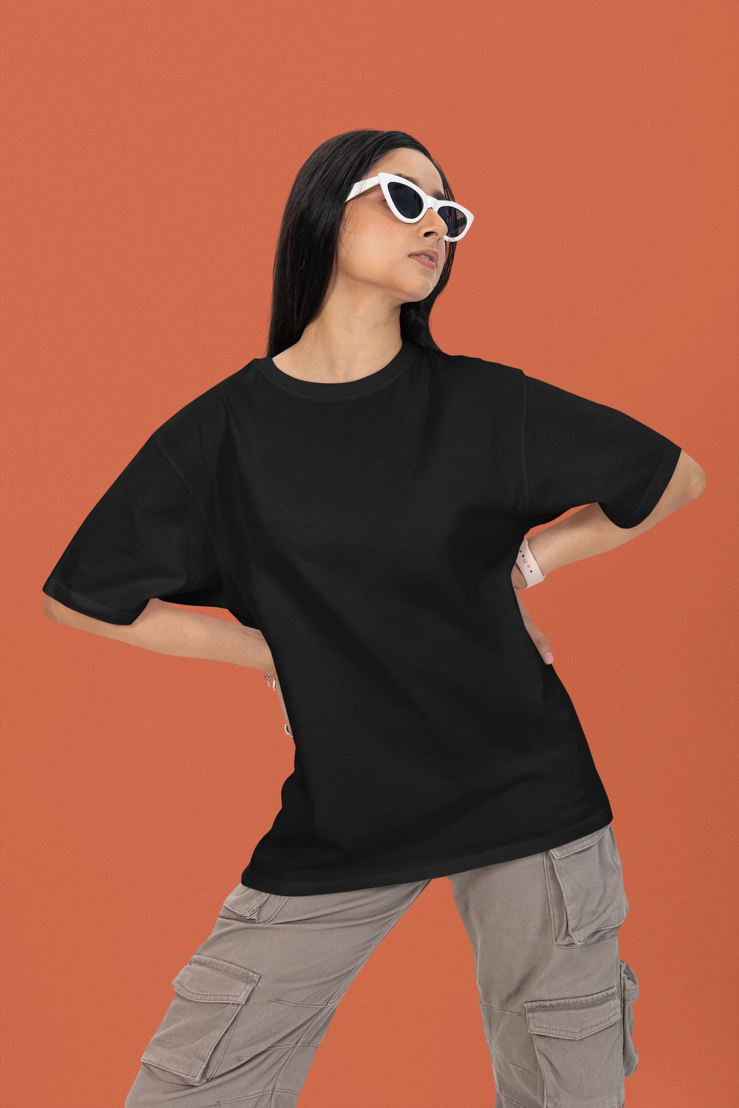 3rd front view of a female model wearing a black oversized t-shirt featuring a couple dancing in the moonlight, inspired by Ed Sheeran's themes of love.