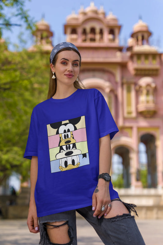Second image of female Models showcasing blue oversized t-shirt inspired by Mickey Mouse Clubhouse characters: Mickey Mouse, Donald Duck, Goofy, and Minnie Mouse