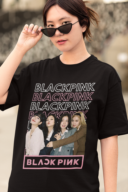 Closeup Front view of female model wearing a black oversized t-shirt featuring a stylish design inspired by the K-Pop girl group Blackpink. Ideal for Blinks (Blackpink fans) and K-Pop music enthusiasts.