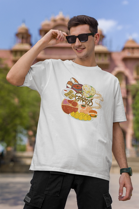 First front view of male model wearing an off white oversized t-shirt featuring a design inspired by the Marathi dish Misal Pav. Ideal for fans of Marathi culture, foodies, and anyone who loves a flavorful meal.
