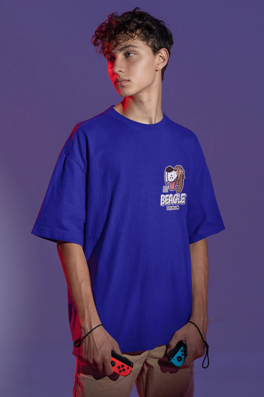 Front view of male Model showcasing blue oversized tee with a The Beagles animated series themed design, featuring the cool canine quartet from ourt disney collection of oversized tees.