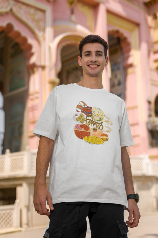 Second front view of male model wearing an off white oversized t-shirt featuring a design inspired by the Marathi dish Misal Pav. Ideal for fans of Marathi culture, foodies, and anyone who loves a flavorful meal.