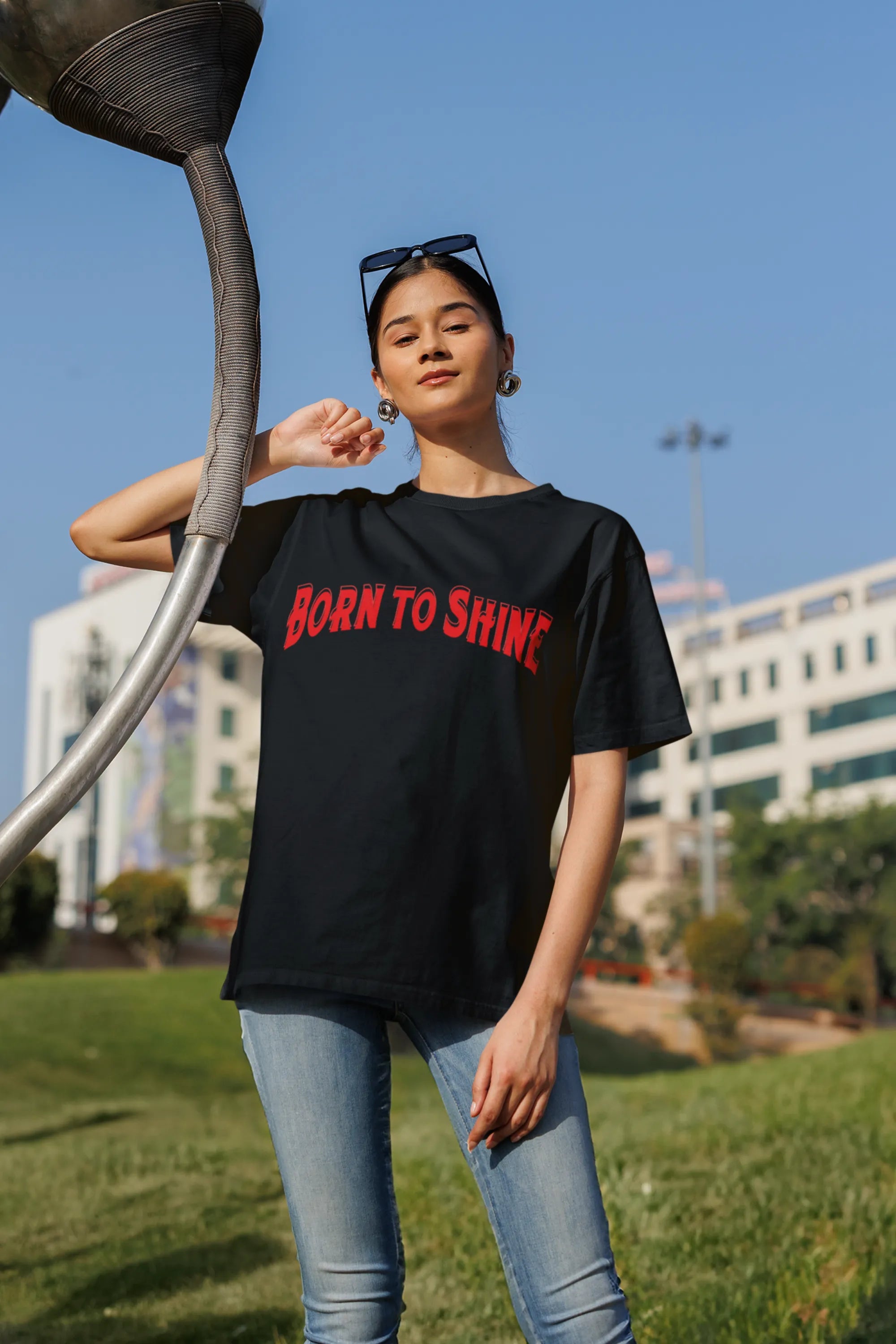 First front image of a female model wearing a black oversized t-shirt featuring a Diljit Dosanjh-inspired design with the text "Born to Shine."
