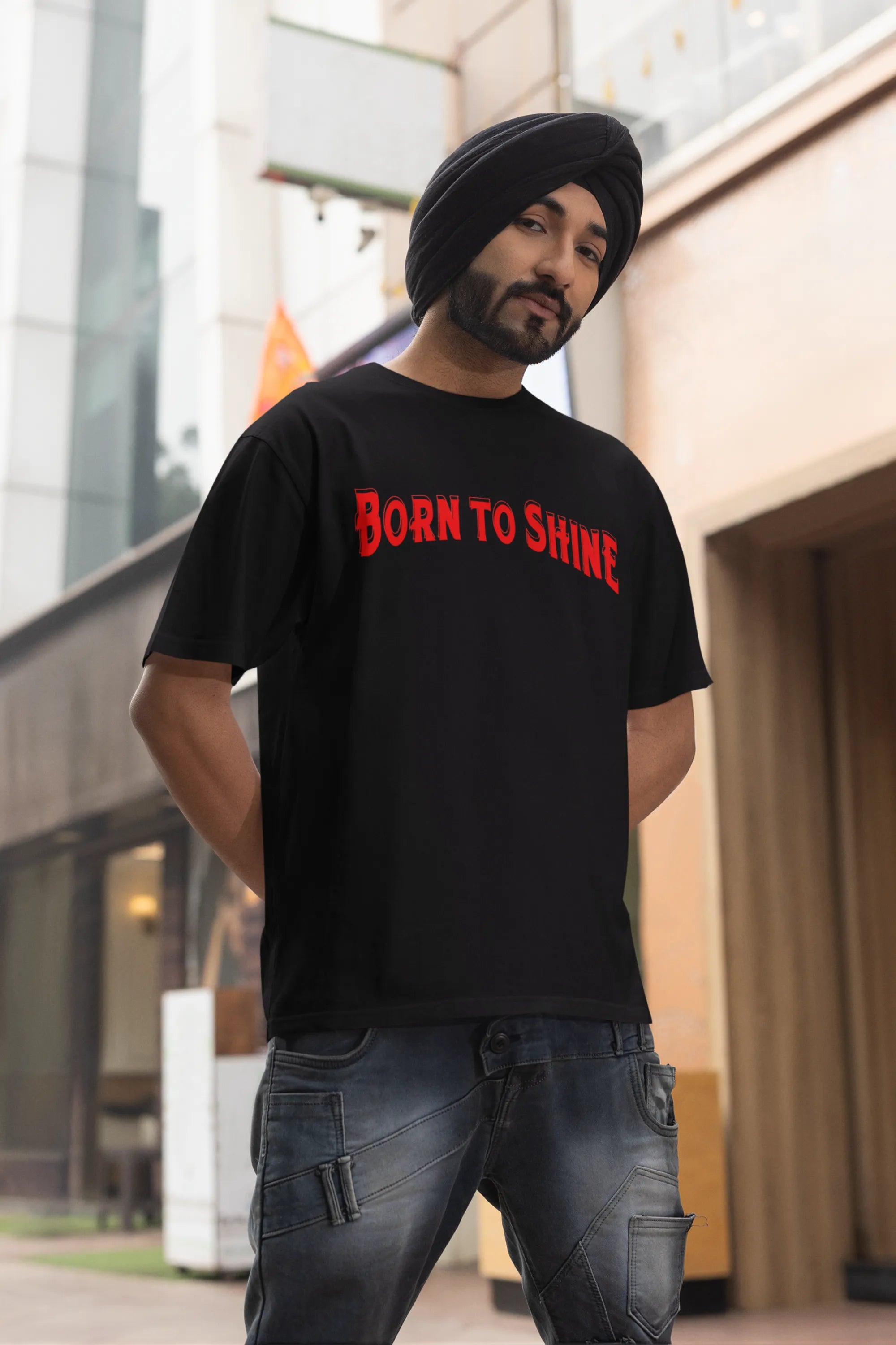 Third front image of a male model wearing a black oversized t-shirt featuring a Diljit Dosanjh-inspired design with the text "Born to Shine."