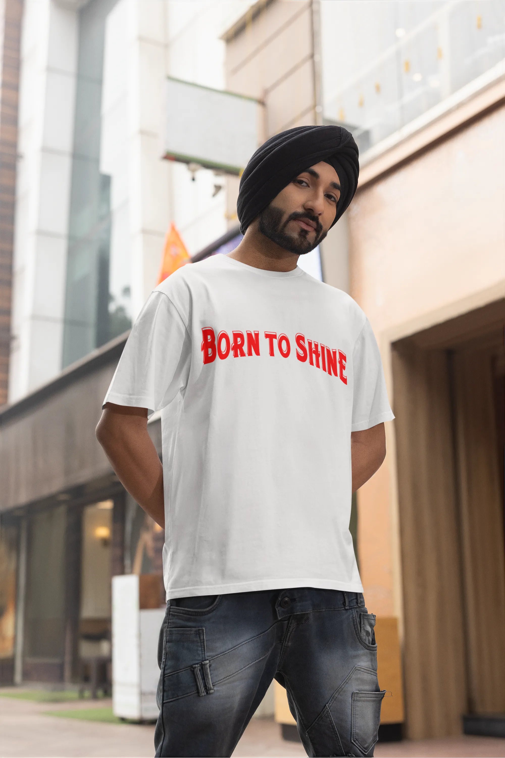 Third front image of a male model wearing a off-white oversized t-shirt featuring a Diljit Dosanjh-inspired design with the text "Born to Shine."