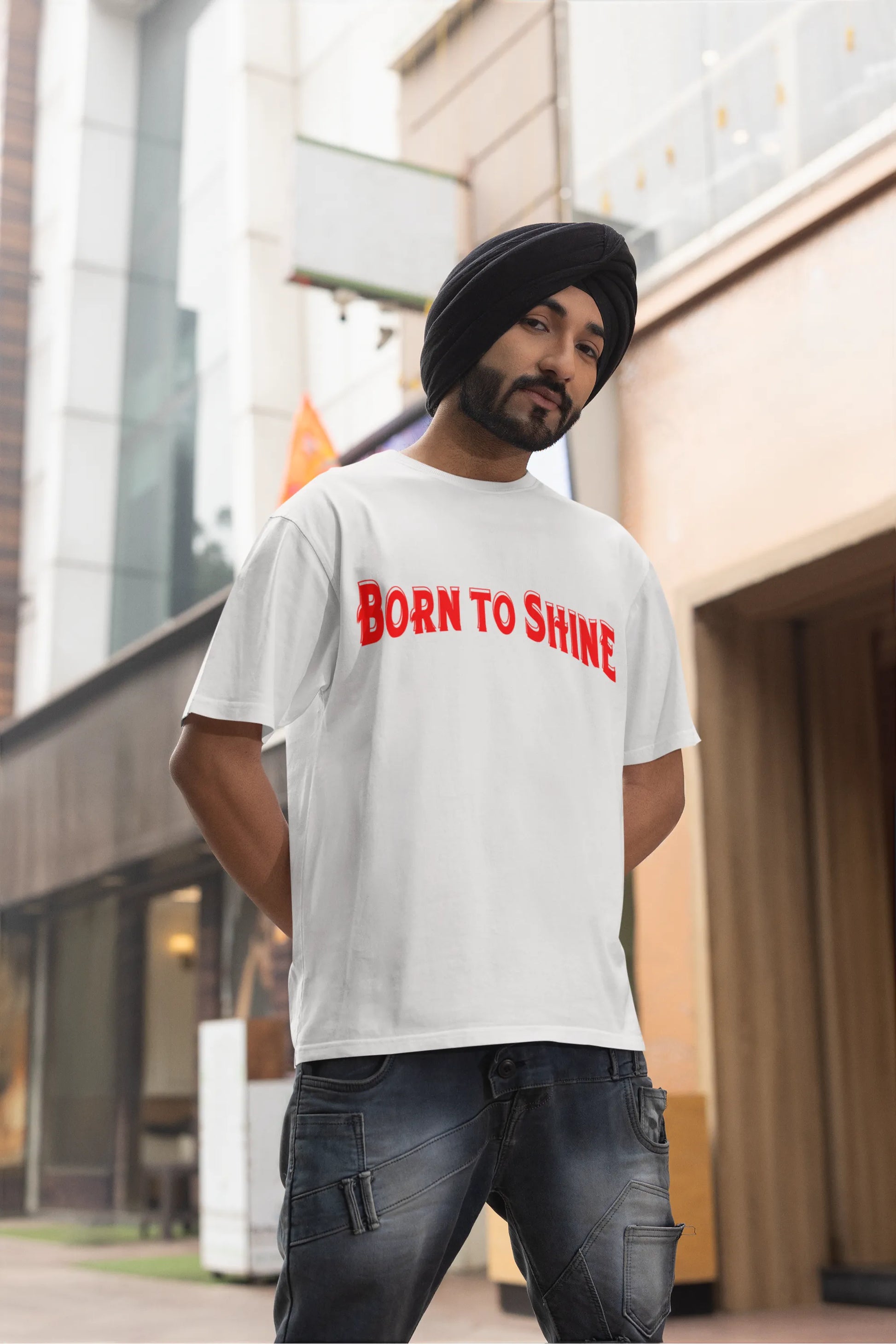 Third front image of a male model wearing a off-white oversized t-shirt featuring a Diljit Dosanjh-inspired design with the text "Born to Shine."