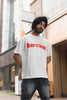 Third front image of a male model wearing a off-white oversized t-shirt featuring a Diljit Dosanjh-inspired design with the text 