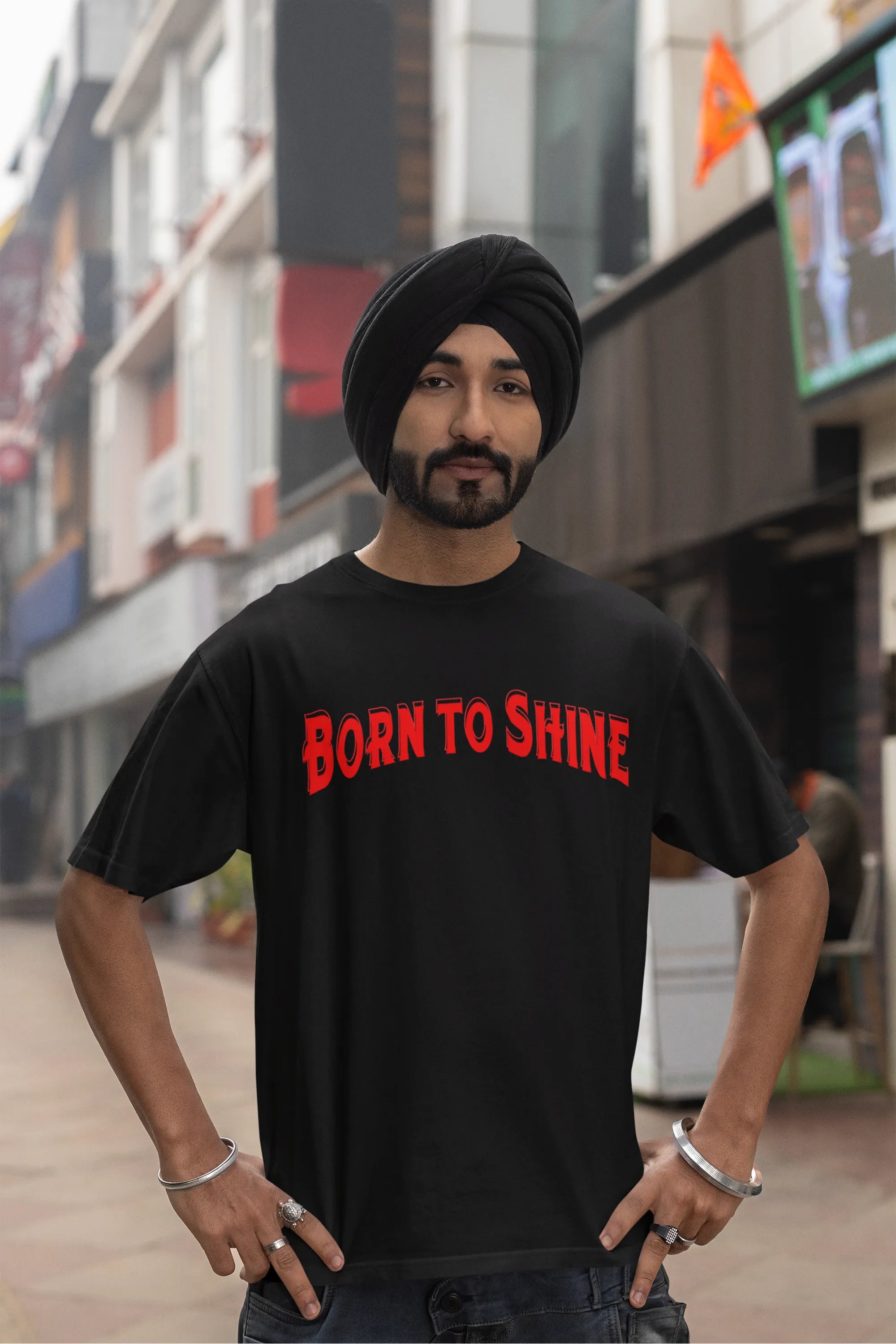 Fourth front image of a male model wearing a black oversized t-shirt featuring a Diljit Dosanjh-inspired design with the text "Born to Shine."