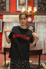 Third front image of a female model wearing a black oversized t-shirt featuring a Diljit Dosanjh-inspired design with the text 