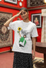 First front view of female model wearing a off-white oversized t shirt with a design of Diljit Dosanjh holding a sunflower, with the text 