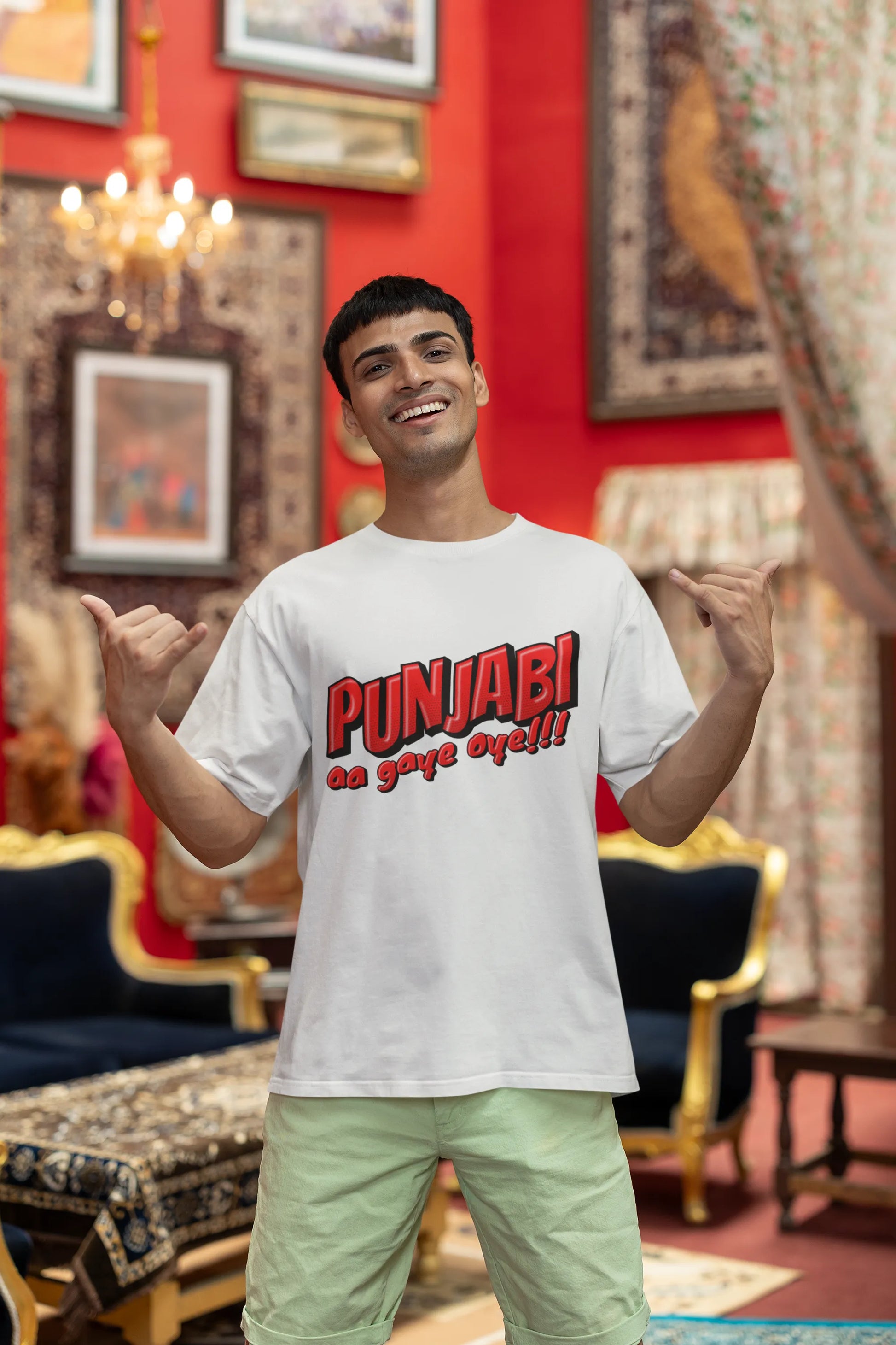 First front view of a male model wearing an off-white oversized t-shirt with the text "Punjabi Aa Gaye Oye".