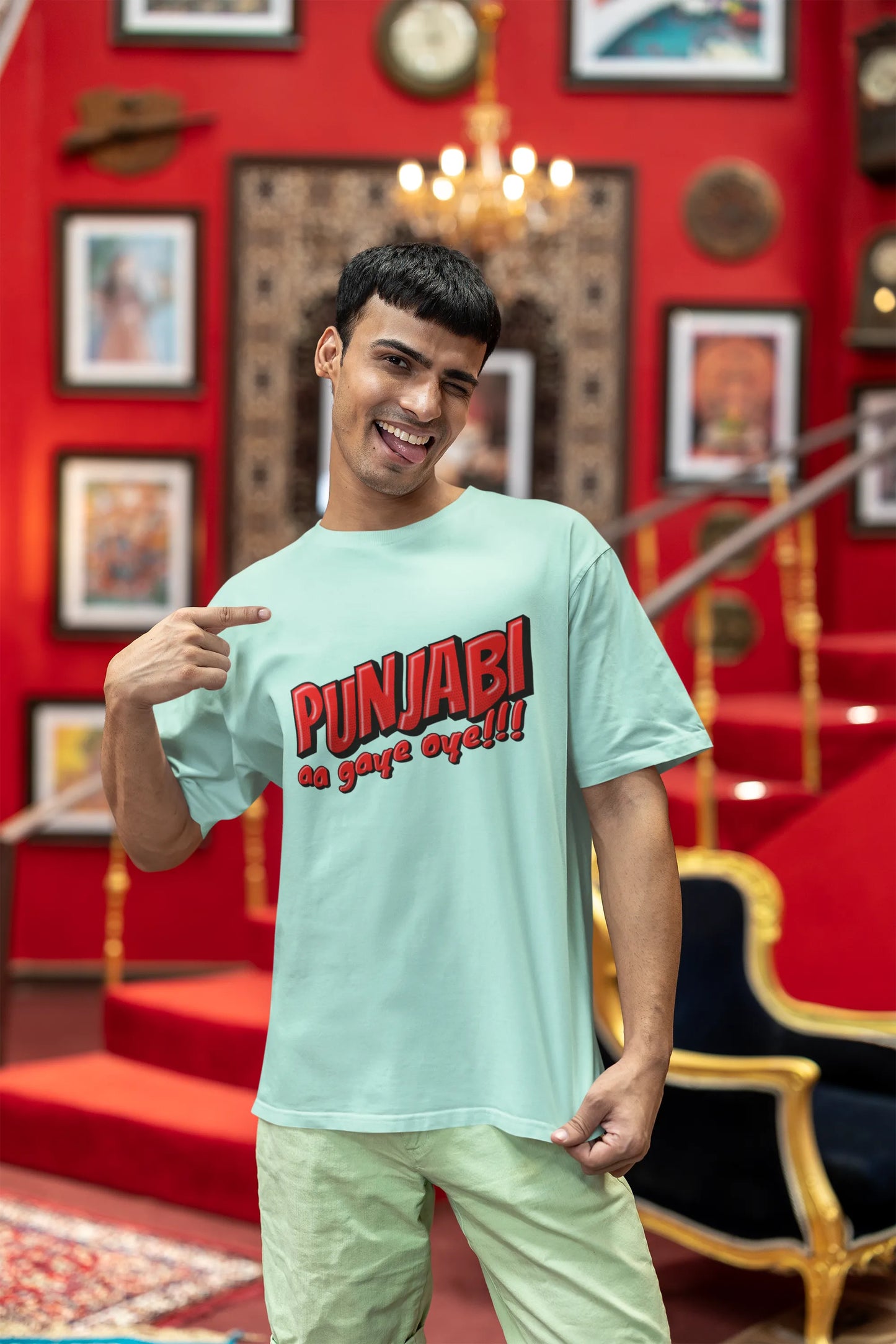 Second front view of a male model wearing an mint-green oversized t-shirt with the text "Punjabi Aa Gaye Oye".