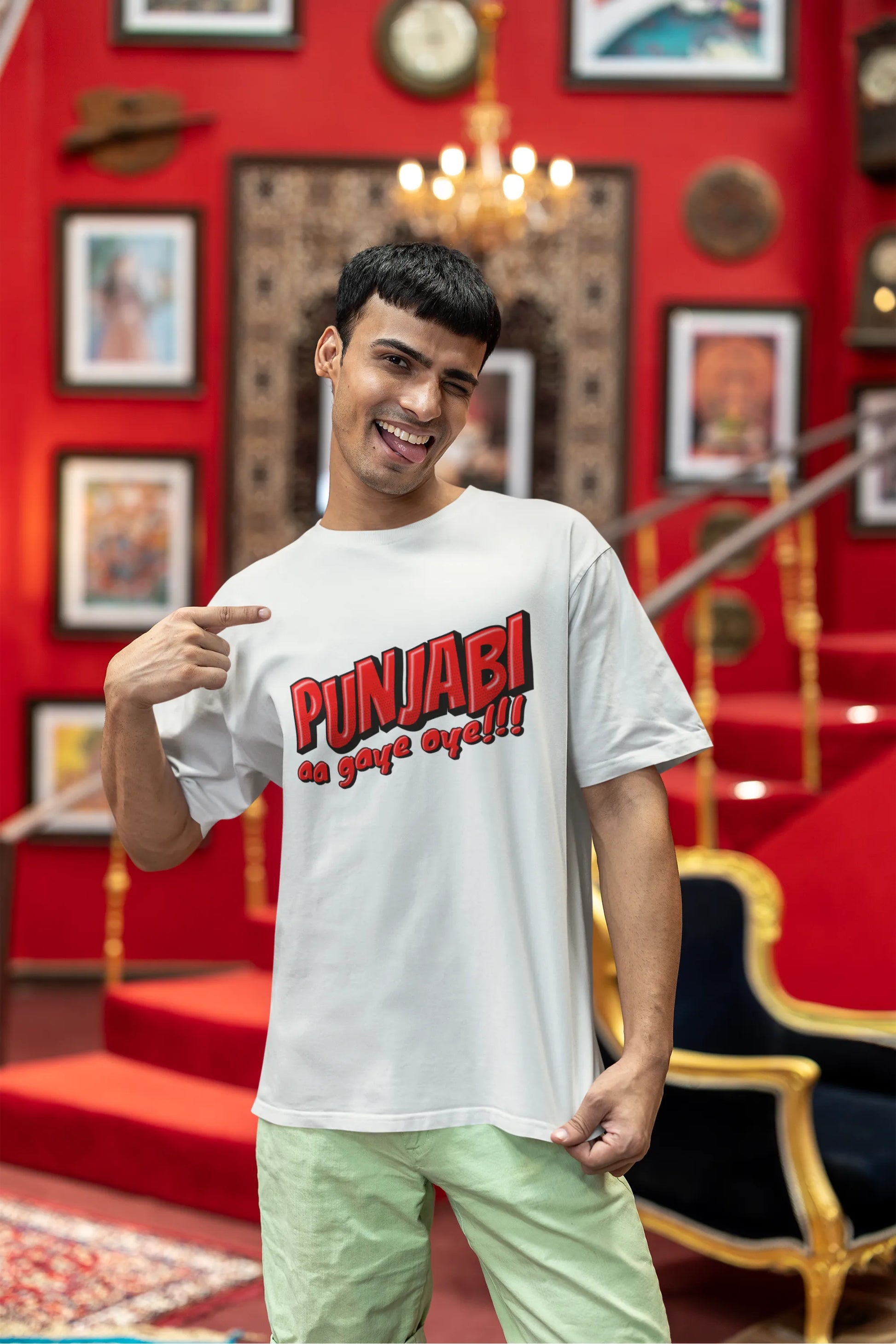 Third front view of a male model wearing an off-white oversized t-shirt with the text "Punjabi Aa Gaye Oye".