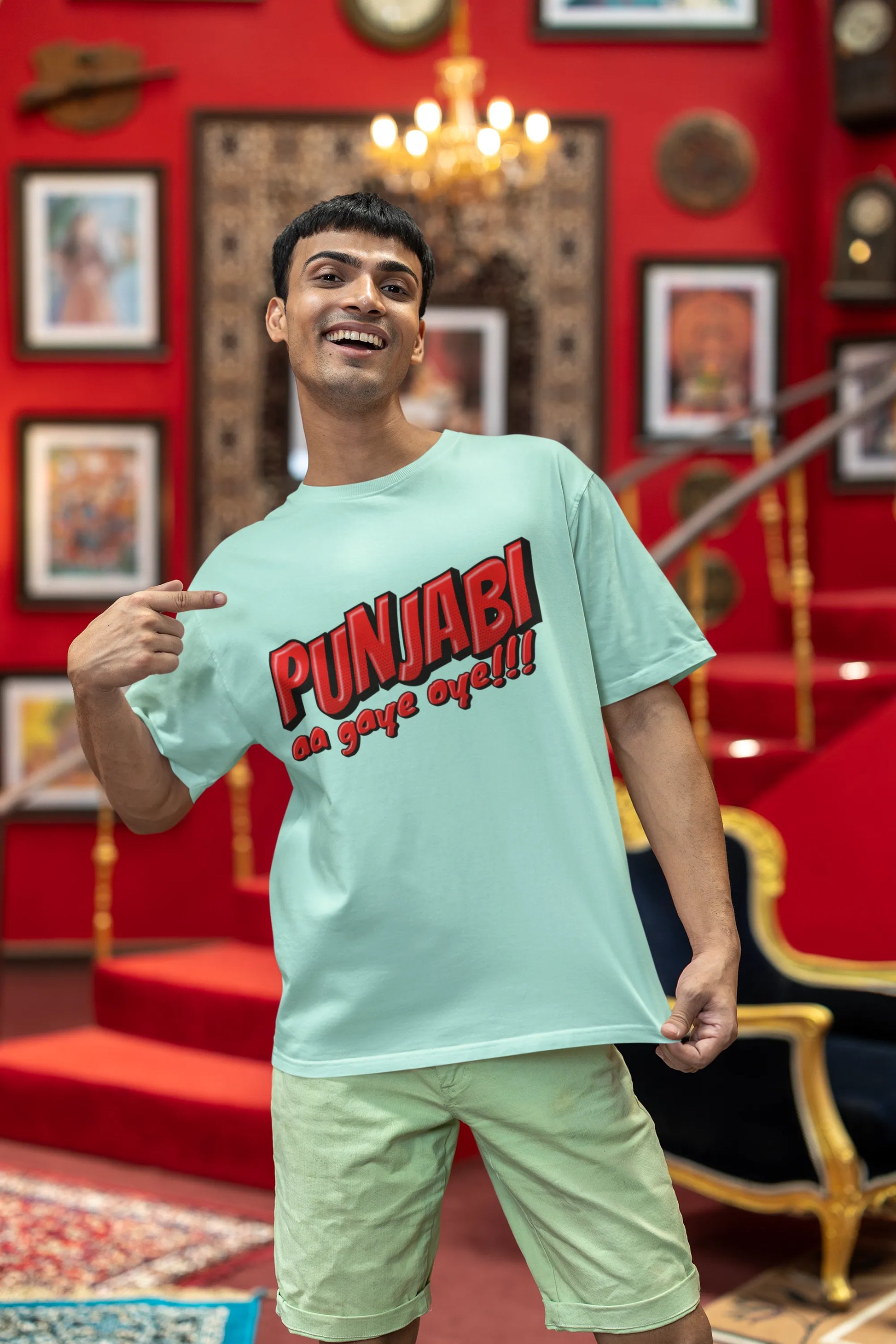 Third front view of a male model wearing an mint-green oversized t-shirt with the text "Punjabi Aa Gaye Oye".