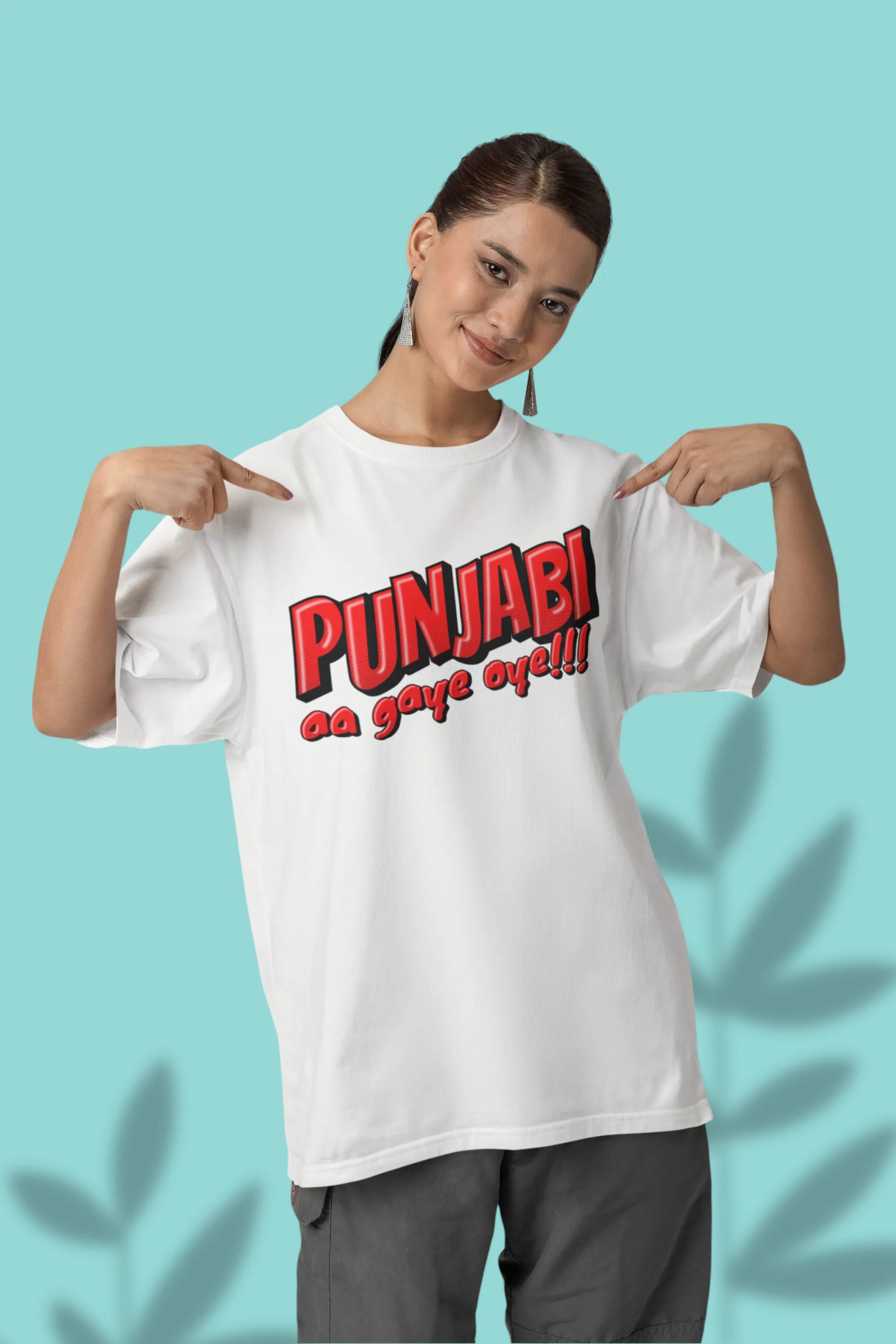 First front view of a female model wearing an off-white oversized t-shirt with the text "Punjabi Aa Gaye Oye".