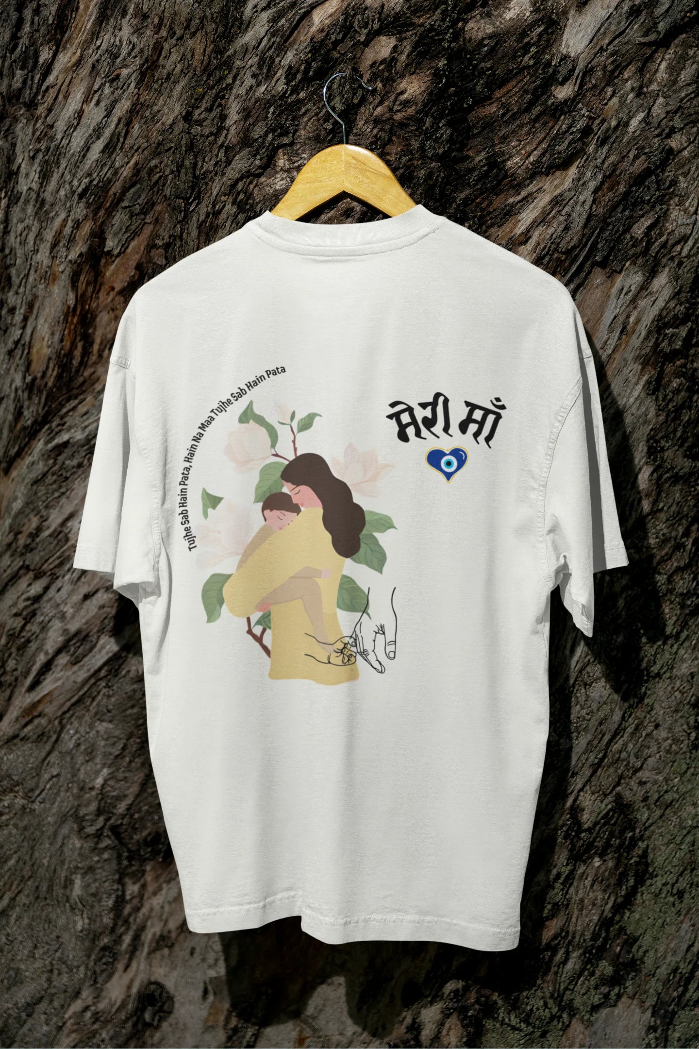 Back view of an off-white oversized t-shirt featuring a design depicting a mother tenderly holding a baby
