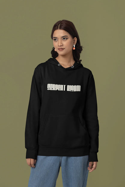 First front view of a female model wearing a black hoodie with a snake coiled around flowers, symbolizing the harmony between nature and its creatures.